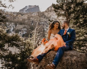 rocky mountain elopement - estes park colorado - rocky mountain national park - interracial couple elopement - sitting on rock next to Bear Lake 1